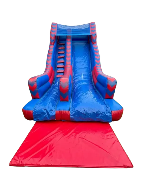 A large red and blue inflatable slide, ready for an event.